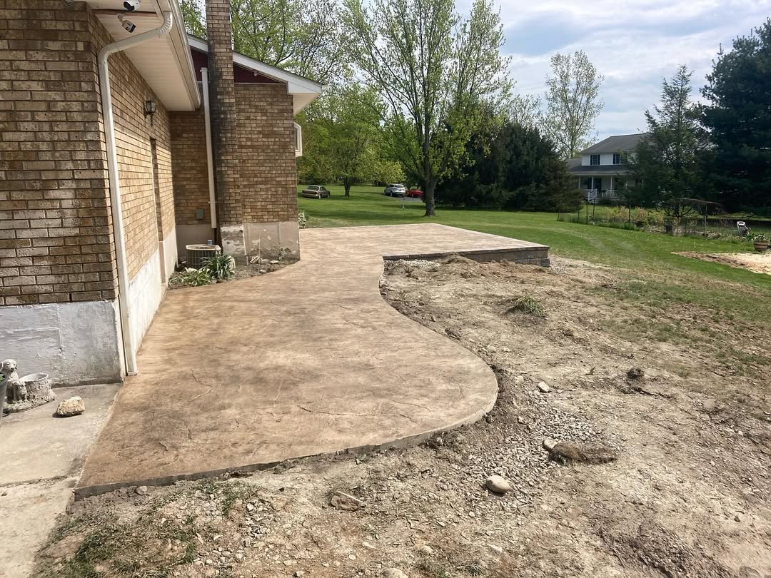 A winding stamped concrete patio.